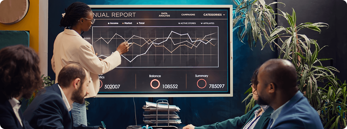 Professional using Oracle Digital Assistant on laptop in modern office